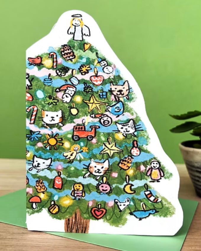Decorative Christmas tree shaped card with cartoon and cat illustrations with a green envelope, on a green background