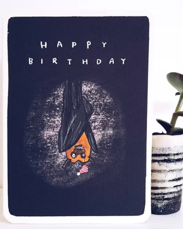 Birthday card with bat illustration and 'Happy Birthday' text on a dark background