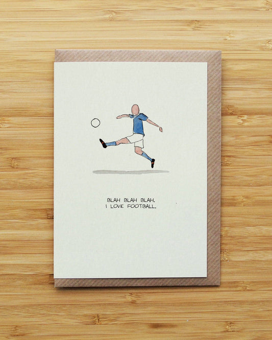 A rectangular greeting card with a brown envelope, featuring a hand-drawn illustration of a soccer player kicking a ball with the text 'BLAH BLAH BLAH. I LOVE FOOTBALL.