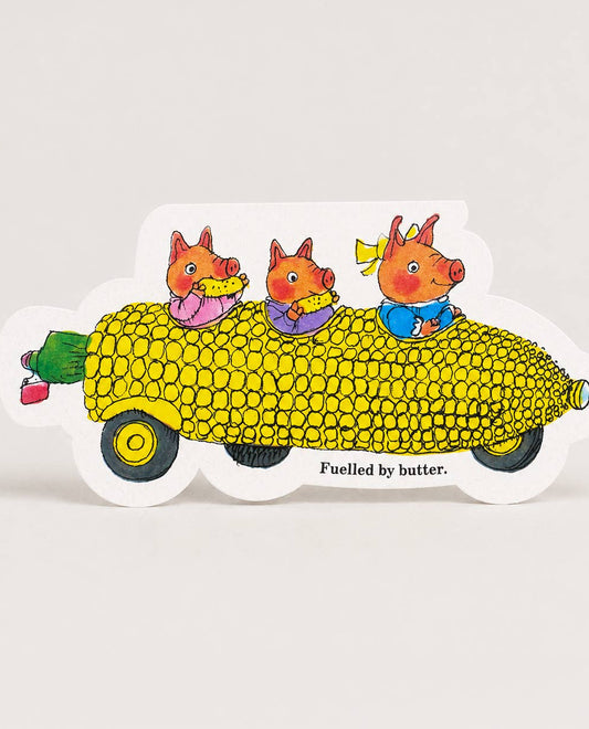 Illustration of three Richard Scarry pigs in a corn-shaped car with text 'Fuelled by butter.'
